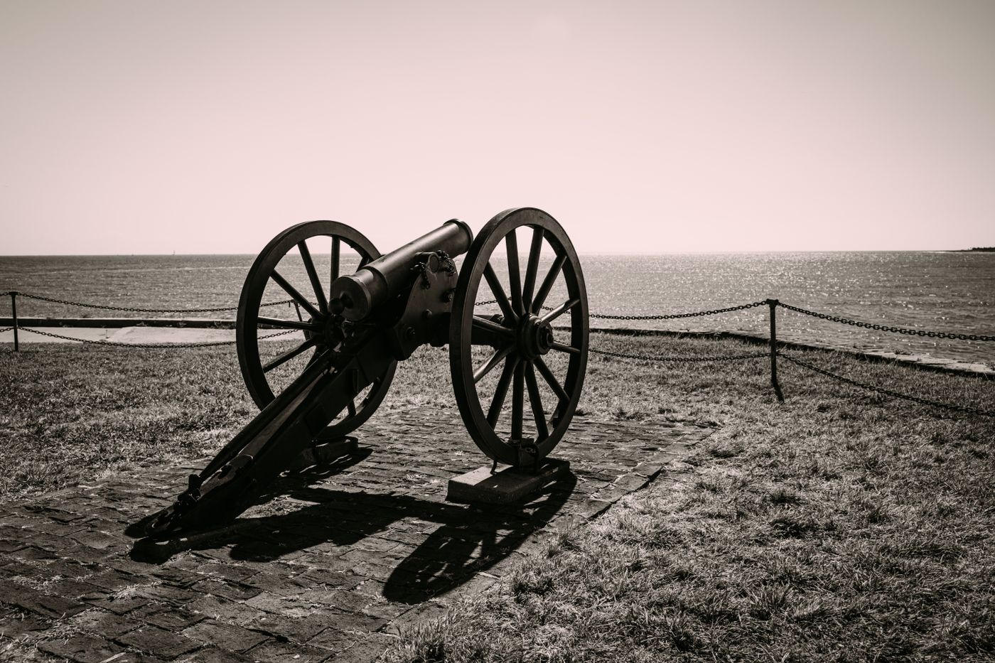 A historic cannon at Charleston's Battery facing the harbor toward Fort Sumter